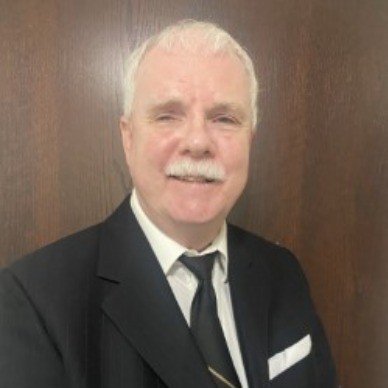 Headshot of Tim Nolan, a man with short white hair and bushy white moustache.